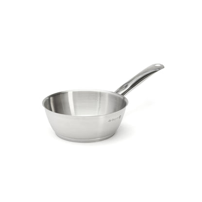 Stainless steel saute pan on a white background